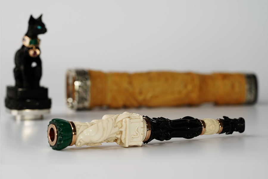Сigarette holder with art carved bone bird, flowers from ebonite and malachite